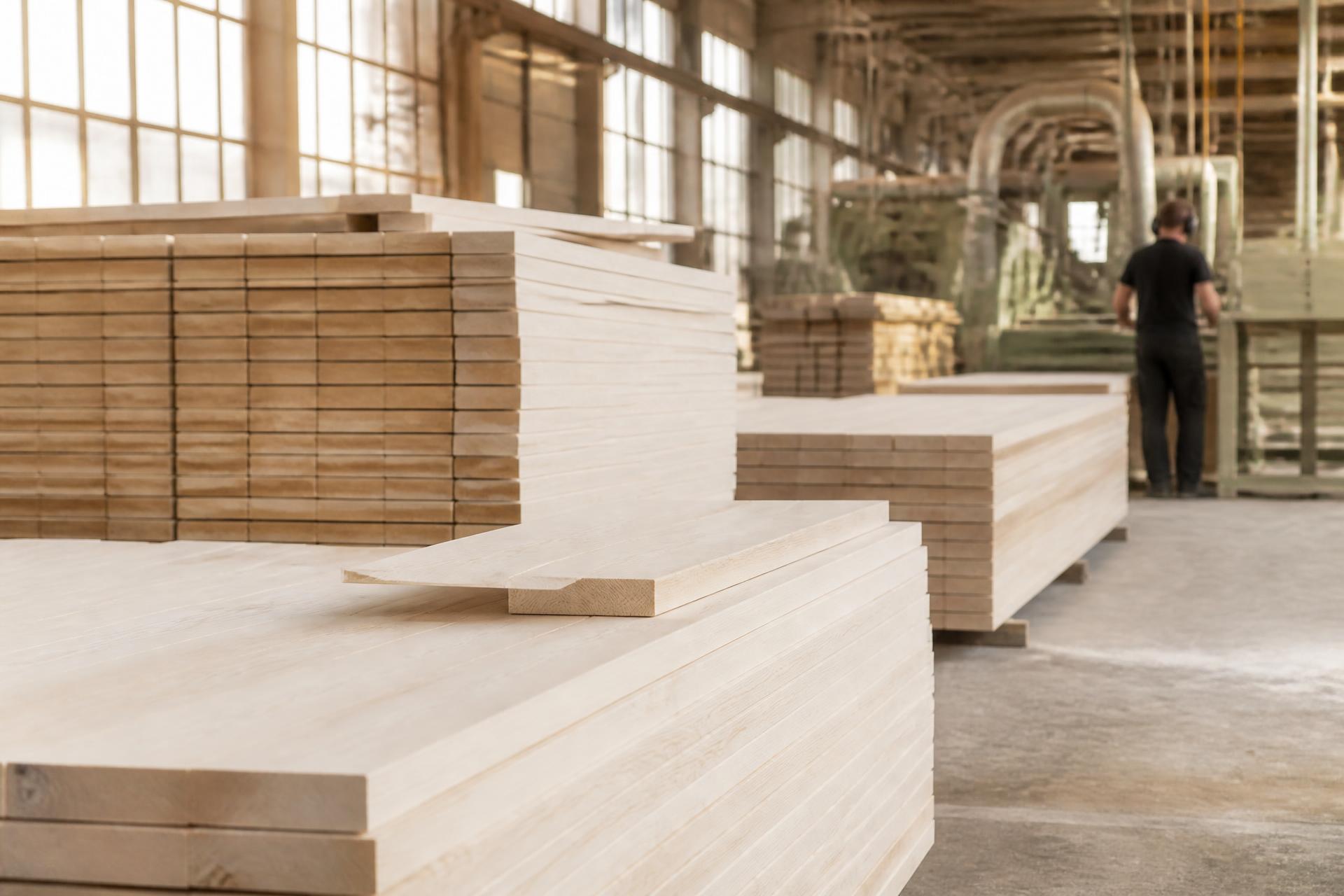 Stacked Baltic birch face-frame lumber inside the TOCO MADERA production facility